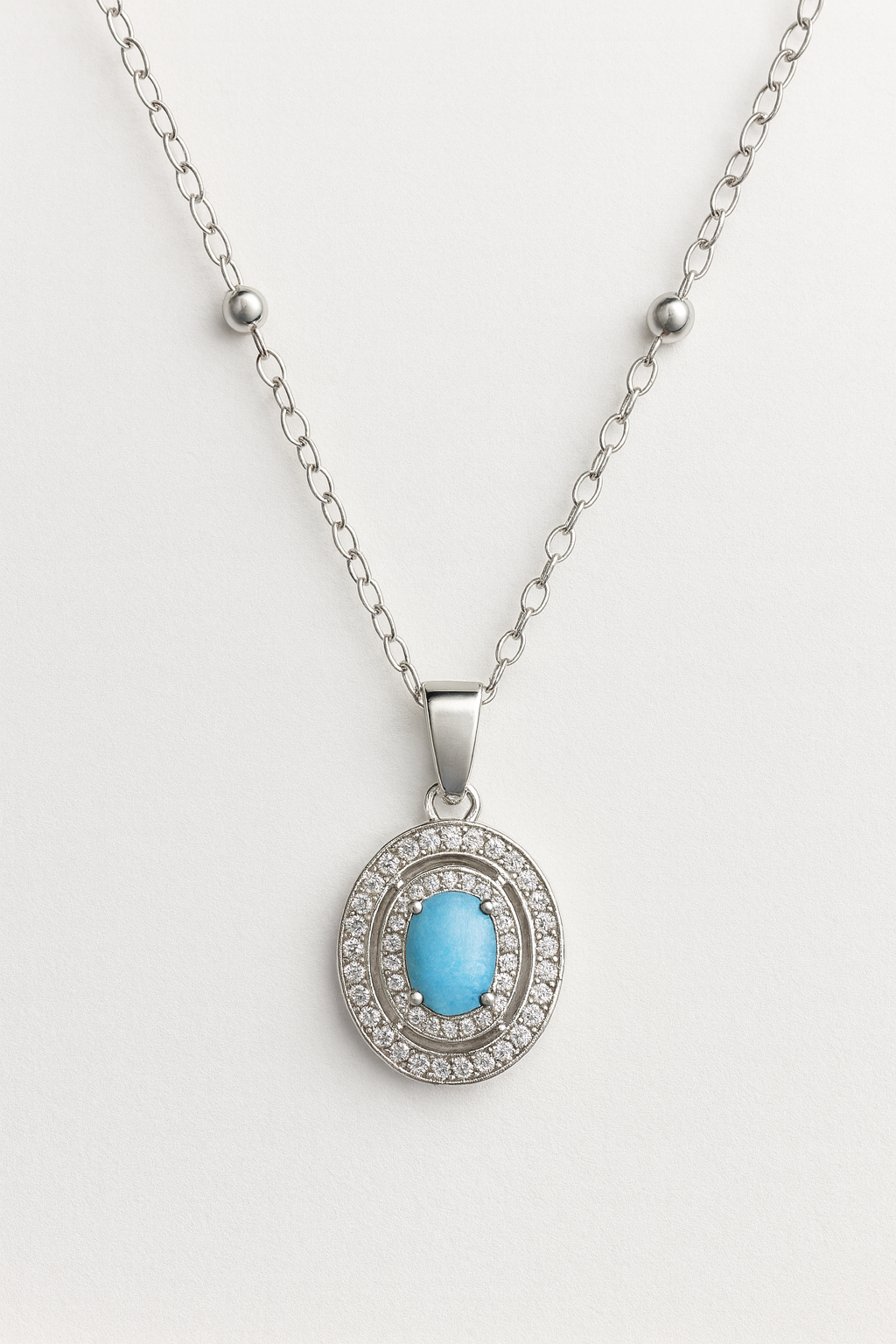 Azure Glow Oval Pendant – Blue Stone & Crystal Artificial Jewellery